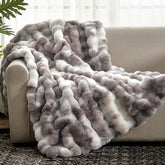 Cozy Bliss Bubble Throw face fur texture provides plush warmth on the sofa.