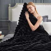 Cozy Bliss faux fur throw blanket, side view on couch, adding warmth and texture.