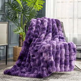 Cozy Bliss faux fur throw with bubble design in purple for sofa warmth.