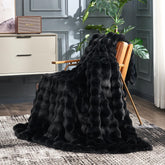 Cozy Bliss faux fur throw with bubble design adds stylish warmth to a sofa.