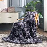 Cozy Bliss faux fur throw on couch with bubble-design for warm, plush comfort.