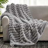 Cozy Bliss faux fur throw on couch for warm, inviting texture