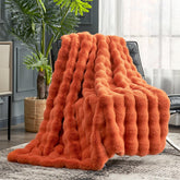 Cozy Bliss orange bubble throw on couch adds warm atmosphere