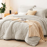 CozyLux beige seersucker queen comforter set on a bed for all-season warmth
