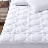 CozyLux Twin XL mattress pad with cotton shell close-up for skin-friendly, breathable comfort.