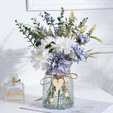 COZZI CODI fake blue flowers bouquet in a glass vase enhances living room decor.
