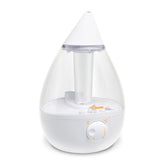 Crane Ultrasonic humidifier in a bedroom with a soft night light for better sleep.