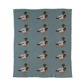 Creative Co-Op soft cotton knit baby blanket with duck print for cuddling.