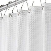Creative Scents white waffle shower curtain with rust-free metal grommets for a spa-like bath.