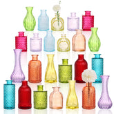 CUCUMI 24-pack colorful glass bud vases with varied shapes for elegant centerpieces.