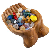 Curawood carved hands offering bowl crystal holder displaying crystals with natural elegance.
