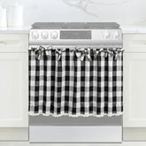 Cyberplex black and white check oven skirt with lace trim enhances cottage-style kitchen decor.