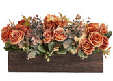 Dahey wood box centerpiece on a table adds a warm focal point
