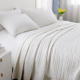 DAWNDIOR Max Oversized California King Quilt drapes generously over an oversized bed.