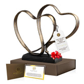 DCAPILLA two hearts and cross sculpture close-up symbolizes unity for couples