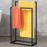 DECLUTTR free standing towel rack with a two-tier design keeps towels organized.
