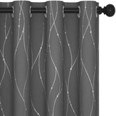 Deconovo blackout curtains with a silver foil print block light while adding a chic shimmer.