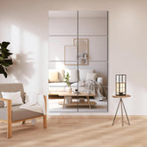 Delma frameless mirror tiles on wall for bright living space reflections.