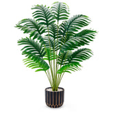 Der Rose tall palm tree in a black-gold pot elevates living room style.