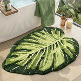 DEXI Monstera leaf bath rug, angle view, plush comfort and natural style.