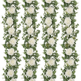Dolicer eucalyptus garland with white roses for wedding decor.