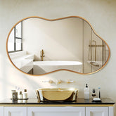 Dorlicecass irregular wall mirror with gold frame enhances space as a modern focal point.