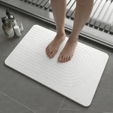 Drvykkn Stone Bath Mat close-up showing rapid water absorption and evaporation.