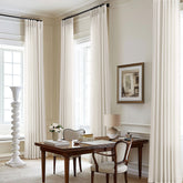 DUKIYO 105-inch cream semi-sheer curtains diffuse daylight for an airy living room.
