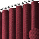 Dynamene Burgundy waffle texture curtain highlights premium fabric for a luxurious bathroom.