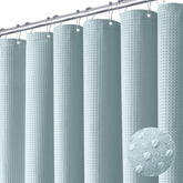 Dynamene fog blue curtain with waffle weave for durable privacy.
