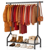 EAGMAK clothing rack with shelf in black in a bedroom setup for organization