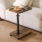 Eansstofars adjustable height couch table tucked under a sofa for easy access