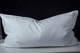 Eastwarmth goose down pillow with cotton stripe cover for breathable comfort.