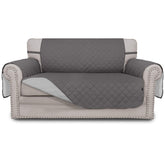 Easy-Going loveseat cover in gray quilted fabric protects furniture from pets