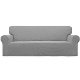 Easy-Going stretch sofa slipcover in light gray closeup shows soft jacquard fabric and daily wear protection.