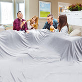 Edenleaf oversized blanket 120x120 on bed and sofa offers cozy warmth for the whole family.