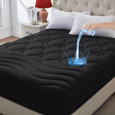 Elven Home mattress pad showing the waterproof backing protection against spills