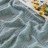EMME Cotton Muslin Large Throw Blanket on couch offers breathable comfort