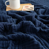 EMME muslin blanket navy 50x70 laid flat shows size and soft texture