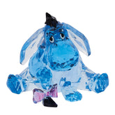 Enesco Facets Eeyore blue figurine on display shelf