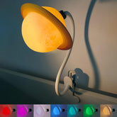 Ergojojo Saturn clip-on lamp in a kid's bedroom provides a soft reading glow.