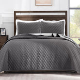 Exclusivo Mezcla California King quilt grey folded demonstrates compact storage and warm coverage