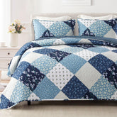 Exclusivo Mezcla reversible blue quilt on bed, vibrant color and all-season warmth.