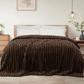 Exclusivo Mezcla twin-size blanket shows soft texture for plush comfort
