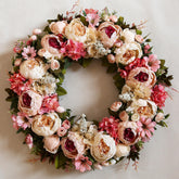 EZsenses Peony Wreath on front door display boosts curb appeal with soft pink blooms.
