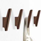 FCOWK walnut wall hooks 4-pack for durable coats and bags in the entryway.