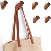 Felidio walnut wall hook close-up highlighting natural grain and smooth finish for entryways.