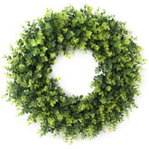 FestalMart 26-inch boxwood wreath close-up on front door with lush texture and year-round appeal.