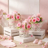 Fiwochic baby carriage centerpiece with pink flowers enhances baby shower decor.
