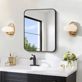 FORBATH 18x24-inch black rectangular mirror enhances bathroom space with a sleek focal point.